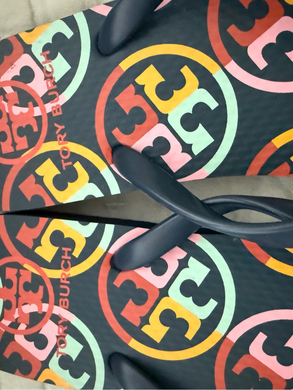 New Tory Burch Navy Strap Flip Flops with Multicolor Logo Print navy base color. - Picture 8 of 10